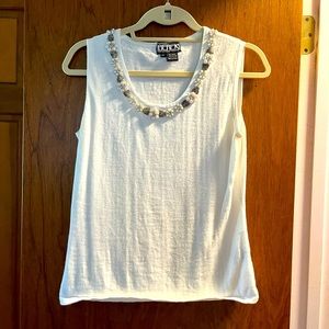 White sleeveless with beaded neckline.